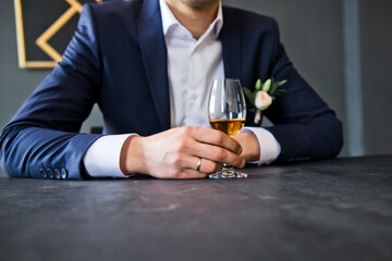 Group of friends guys with glasses of whiskey