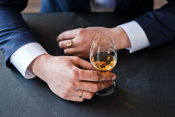 Group of friends guys with glasses of whiskey