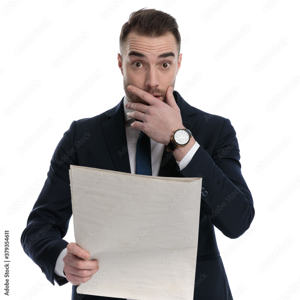 Poster Worried businessman reading newspaper and covering mouth