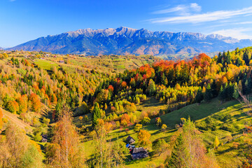 Brasov, Romania. Magura village and Bucegi mountain range.