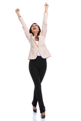 Obraz na płótnie Canvas Cheerful businesswoman celebrating and screaming while walking