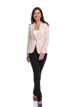 Positive businesswoman smiling and walking