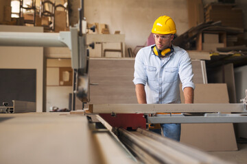 Carpenter working in a furniture factory