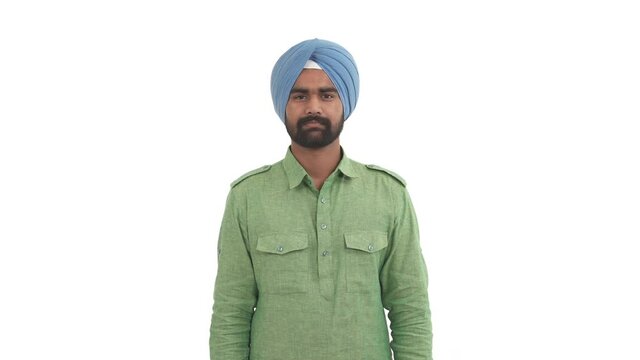 Portrait of young Indian man moving head side to side diagonally. Indian head bobble gesture. Yes, no, maybe wobbles. Isolated on white background