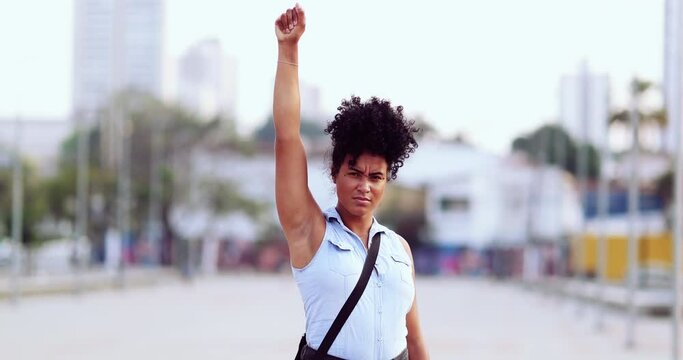 Female political activist raising fist in the air