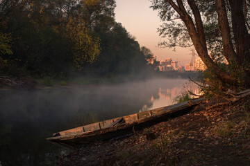 Men fishing in river with fly rod during summer morning. Beautiful fog.