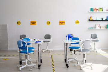 Syringes, protective glasses on desk, coronavirus, covid-19 and vaccination concept.