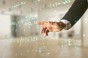 Man hand working with scientific formula hologram on blurred classroom background, research concept. Multiexposure