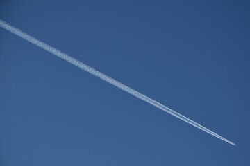 Single airplane in the blue sky.