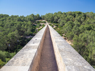 Fototapeta na wymiar Passage on the Antique Roman aqueduct known as El Pont del Diable (The devil's bridge), Tarragona, Catalonia, Spain.