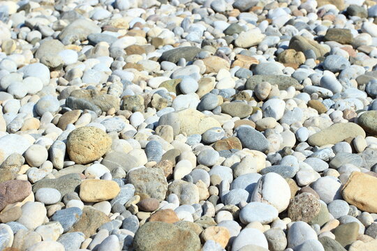 Colorful rounded rocks, pebbles on the river coast
