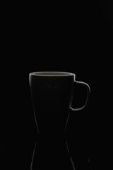 Dirty Ceramic Coffee Mug On a dark tone black background.