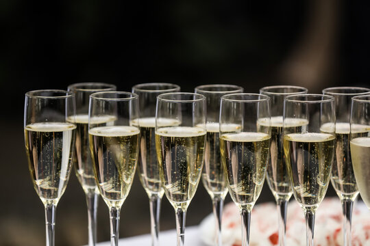 Glasses of champagne on a white table. Celebration event. 