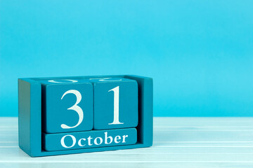 wooden calendar with the date of October 31 on a blue wooden background, World Cities Day; International Day of the Black Sea; International Day of Savings