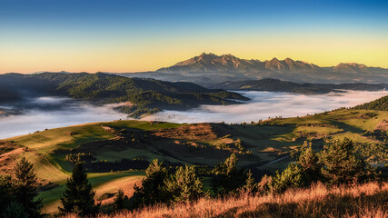 beautiful landscape with valleys, lakes and rivers in fog