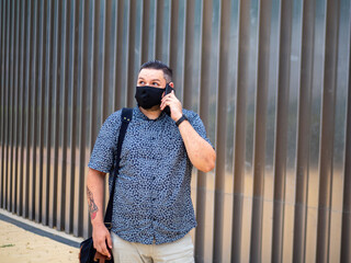Shot of a man walking  in a medical mask - new normal