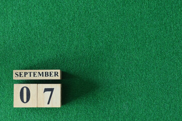 September 7, number cube on snooker table, sport background.