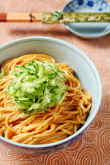 A Bowl Of Dan Dan Noodles With Cucumber Shreds