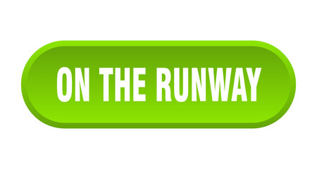 on the runway button. rounded sign on white background