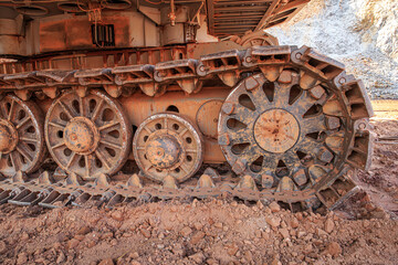 Crawler tracks of a large excavator in clay soil