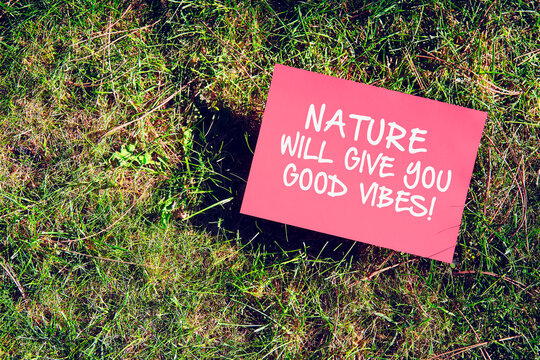 Nature will give you good vibes quote written on paper on grass background. Inspirational motivational message for orientation with nature.
