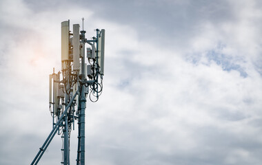Telecommunication tower with white cloudy sky. Antenna. Radio and satellite pole. Communication technology. Telecommunication industry. Mobile or telecom 4g network. Telecommunication industry.