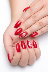  Red manicure on sharp long nails with white painting and crystals. Gel nail design. Red classic.