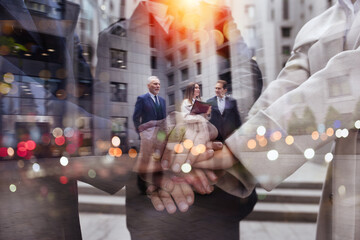 Business people putting their hands together. Concept of teamwork and partnership