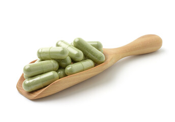 Close up,Andrographis Paniculata capsules (Herbal capsules) isolated on a white background.
