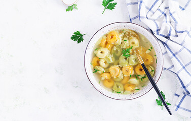 Tortellini in broth, italian traditional dish. Italian pasta. Top view, flat lay, overhead