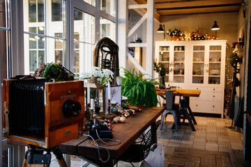 Naklejka premium Christmas decor of a country house in a retro style. vintage in the interior. festive mood during the winter holidays.