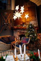 Christmas decor of the house with a fireplace. cozy holiday interior of a country house. new year.