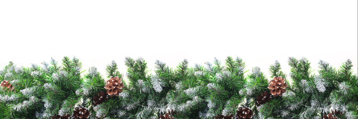 Christmas frame with snow-covered branches of fir-pine, with cones, isolated on white background....