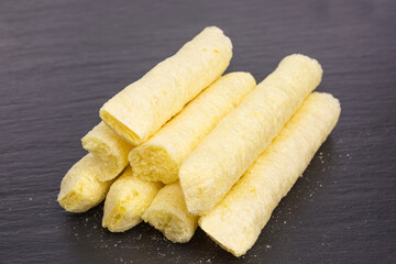 heap of bio puffed corn sticks snack