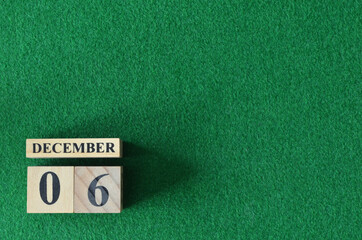 December 6, number cube on snooker table, sport background.