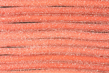 chewy strawberry flavored gummy candy ropes - 379381252
