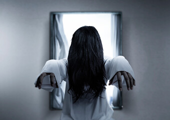 Scary ghost woman standing in the abandoned house