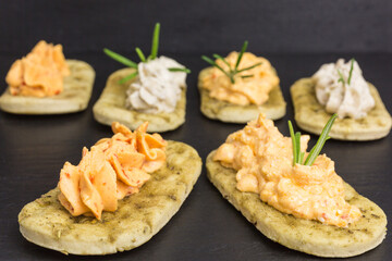 mini rosemary focaccia with different cream cheese spreads - eggplant, bell pepper and sweet chili