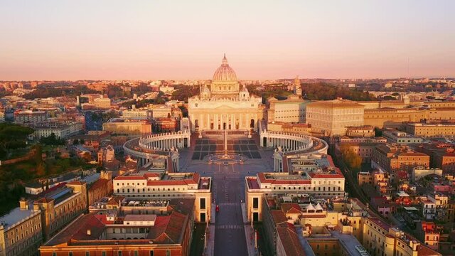 rome vatican city st peter basilica aerial view at sunrise,drone moving out from the house window