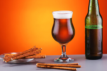 cold beer and delicious bread sticks with poppy seeds wonderful in hot weather