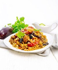 Rice with vegetables and chicken in plate on white board