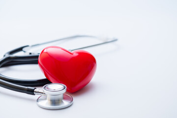 Closeup Stethoscope with red heart, healthcare heart check concept, world heart health day, health insurance concept. copy space