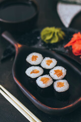 Sushi with salmon, cream cheese Philadelphia, cucumber and wasabi