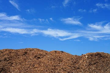 Big pile of wooden chips used as garden mulch
