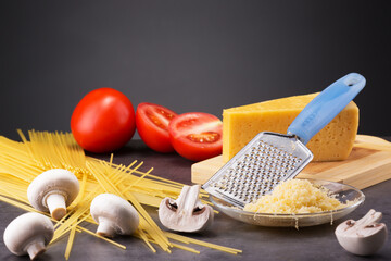cooking delicious pasta with mushrooms champignons and tomatoes