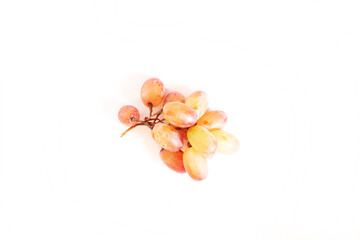 Sprig of red grapes isolated on white background