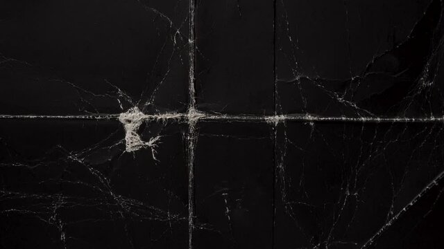 Old black wrapping paper with old folds. Abstract retro grunge pattern. Light movement