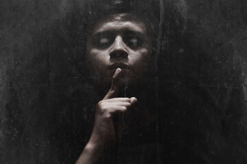 Man possessed on dark background