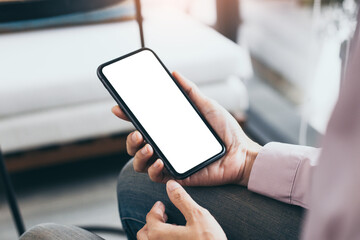 cell phone mockup blank white screen.woman hand holding texting using mobile on desk at coffee shop.background empty space for advertise.work people contact marketing business,technology