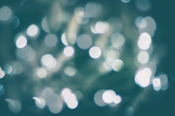 Disposessory abstract Christmas background in blue. Abstract bokeh on a blue background.